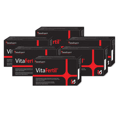 Sechs Packungen des Nahrungsergänzungsmittels VitaFertil in Schwarz mit roten Akzenten gestapelt.